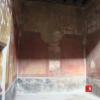 Interno domus con affreschi rosso "pompeiano"